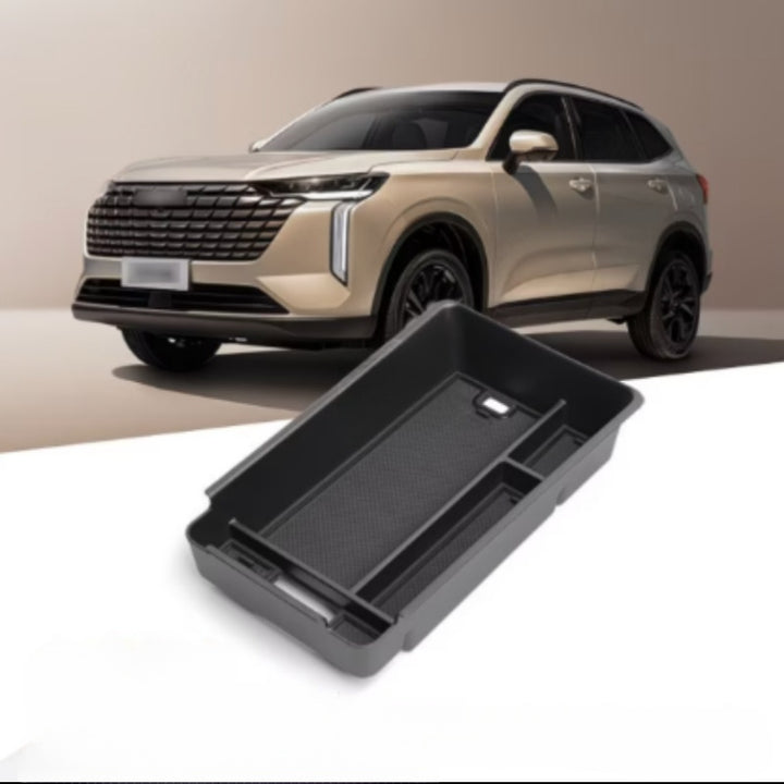 Black center control storage box for GWM HAVAL H6 displayed in front of a gold SUV